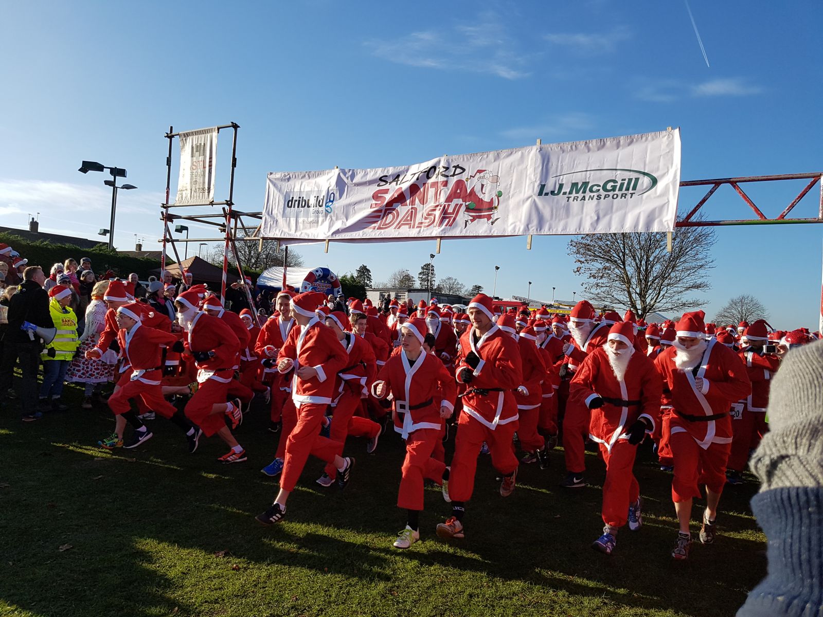 large goup of people all dressed as Santa Claus 