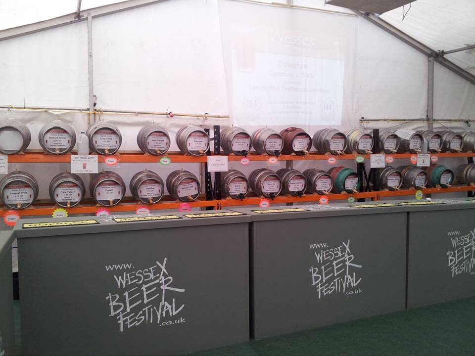 photo showing barrels of beer in a tent